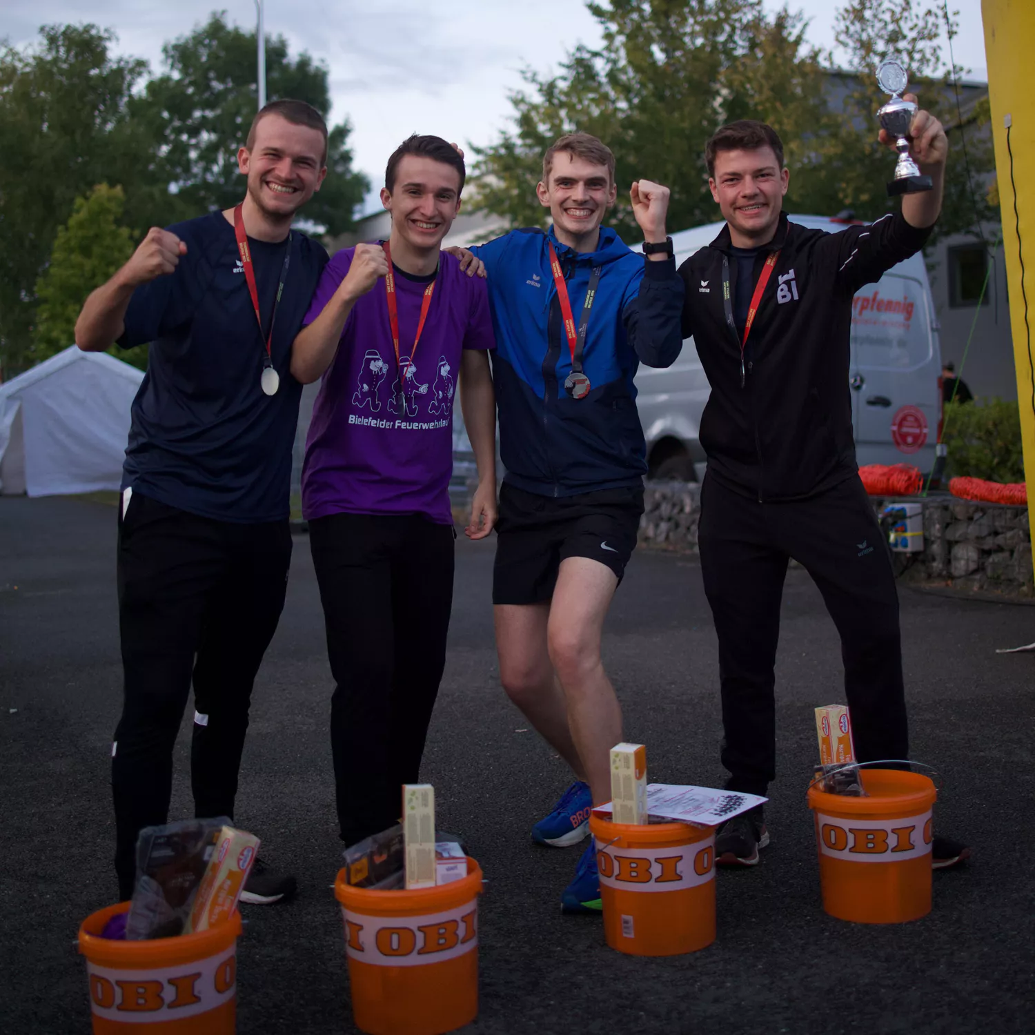 Firefighter holding a finish line tape