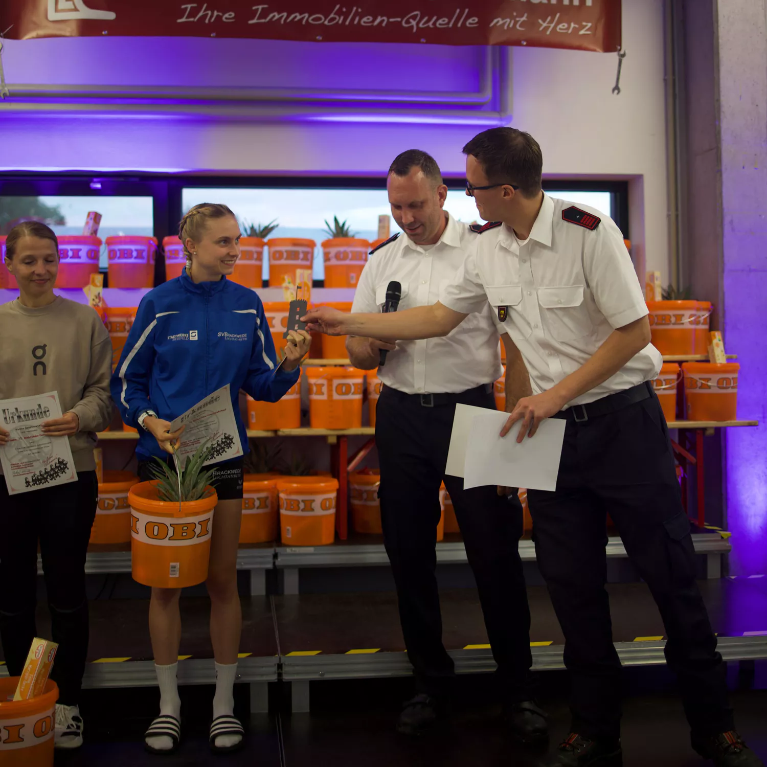 Firefighters handing out water to runners