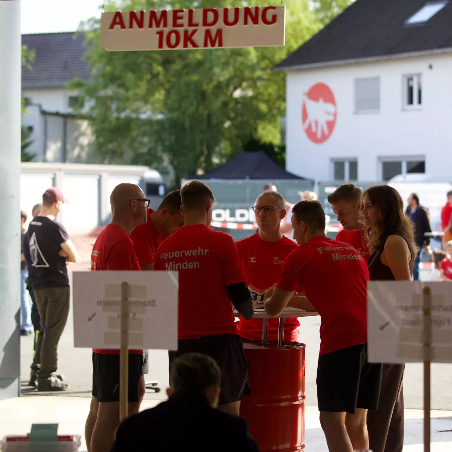 Group of firefighters cheering on participants