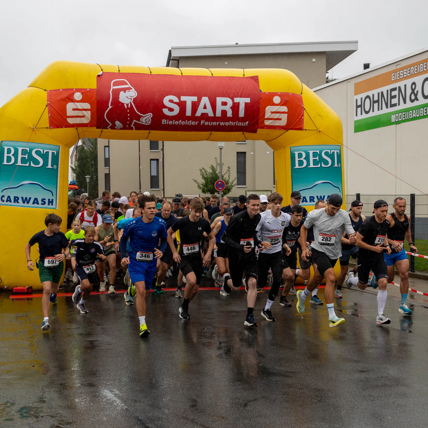 Group of firefighters cheering on participants