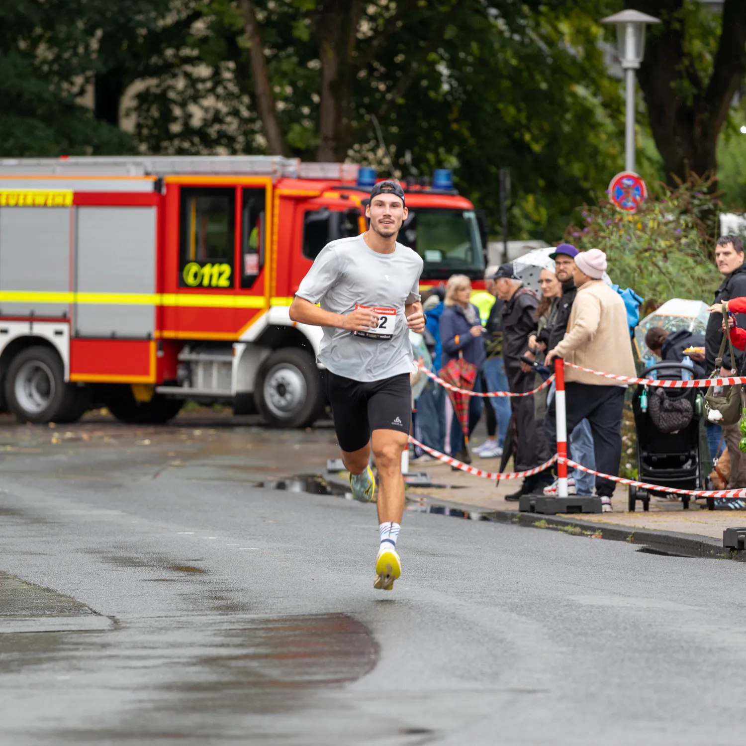 Firefighters handing out water to runners